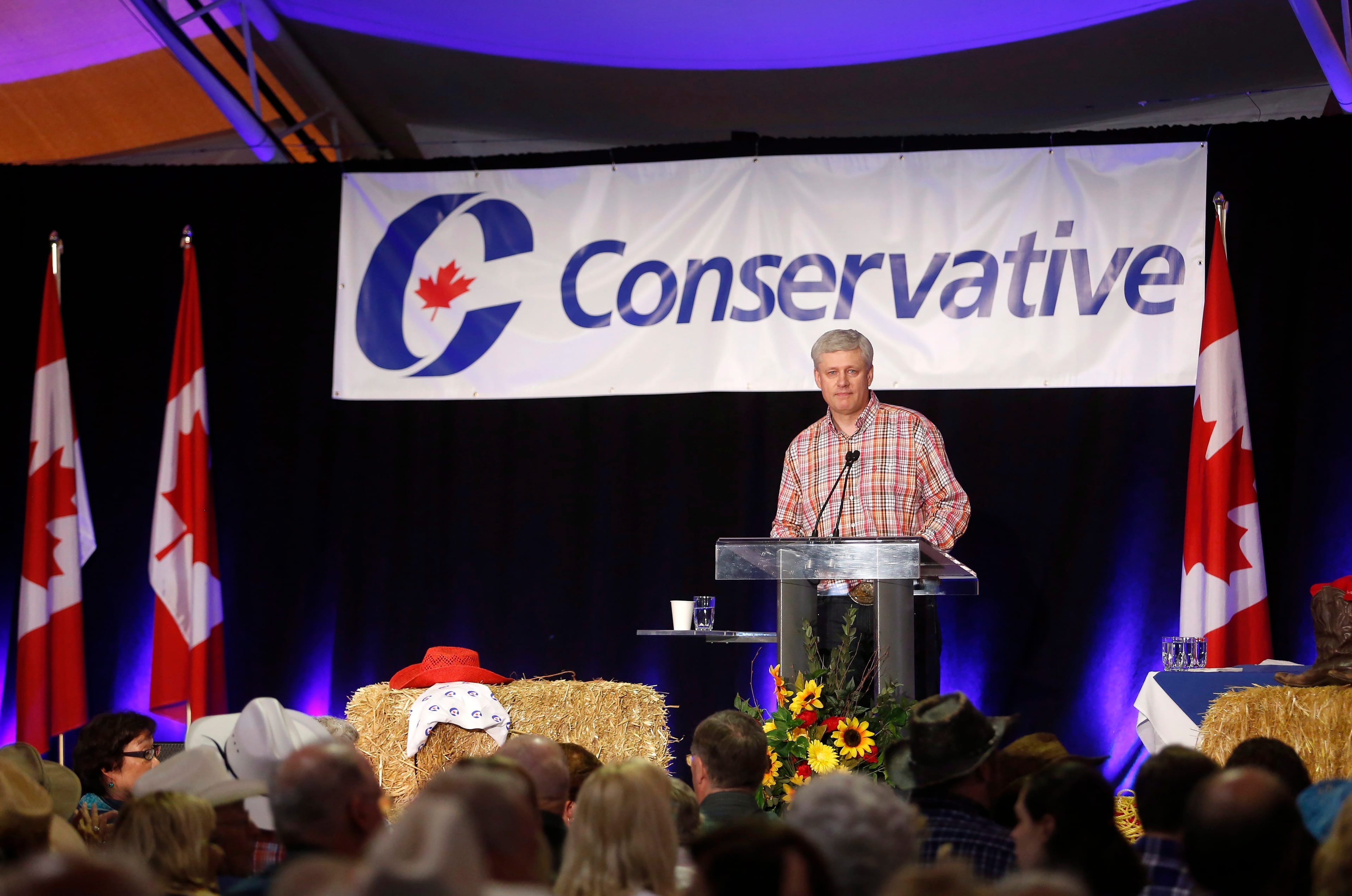 Former Prime Minister Stephen Harper speaks to attendees at the annual Calgary Conservative barbecue in Calgary, Saturday, July 9, 2016. THE CANADIAN PRESS/Jeff McIntosh