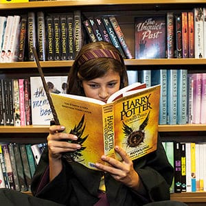 Amy Stocking reads from Harry Potter and The Cursed Child at the 12:01 launch of the book at Indigo (Bay and Bloor). Photograph by May Truong