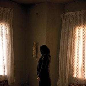 Zanib who escaped three times from ISIS at Yazidi refugee camp Khanke outside of Duhok, Iraq, July 26, 2016. Zane did not give her last name or want her face visible because female relatives are still captive. (Photograph by Peter Bregg C.M.)
