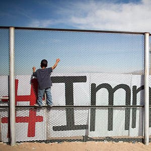 Two small boys balance themselves on the rail of a border fence during an event organized by the Border Network for Human Rights, on the outskirts of Ciudad Juarez, Mexico, Monday, Feb. 15, 2016. (Ivan Pierre Aguirre/AP)