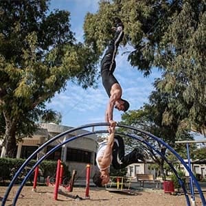 Members of Palestinians sports group “Bar Palestine” Preparing to perform Street workout, on the public garden in Gaza City, on Dec 11, 2015. Street workout, that is still new to Gaza, is a growing sport across the world. (Hosam Salem)