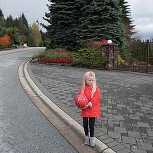 A young girl plays in The British Properties neighbourhood of Vancouver. (Photograph by Simon Hayter)