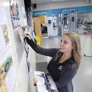 Amanda McManus, 27, a graduate of Mohawk College who did her internship at ArcelorMittal and now works there as a fitness and wellness consultant, works in the fitness centre of the F.H. Sherman Recreation and Learning Centre in Hamilton, Ontario on September 29, 2016. (Photograph by Peter Power)