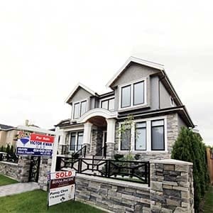 Realtors' signs are hung outside a newly sold property in a Vancouver, B.C., Canada neighbourhood where houses regularly sell for C$3-C$4 million (US$2.7-3.6 million) September 9, 2014. (Jim Tanner/Reuters)