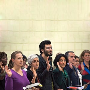 New Canadians take the oath of citizenship at a ceremony in Dartmouth, Nova Scotia. (Andrew Vaughan/CP)