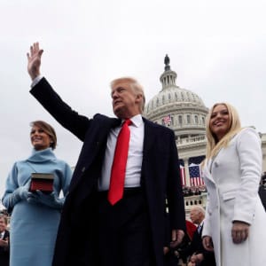 WASHINGTON, DC - JANUARY 20: U.S. President Donald Trump acknowledges the audience after taking the oath of office as his wife Melania (L) and daughter Tiffany watch during inauguration ceremonies swearing in Trump as the 45th president of the United States on the West front of the U.S. Capitol in Washington, DC. January 20, 2017. (Photo by Jim Bourg - Pool/Getty Images)