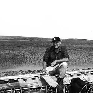 Lawrence Millman seated on komatik. (no credit)