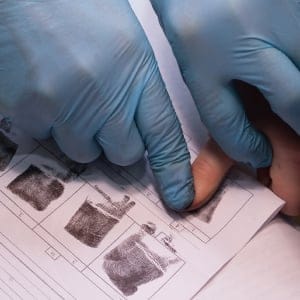 Expert takes a fingerprint of the suspect (iStock)