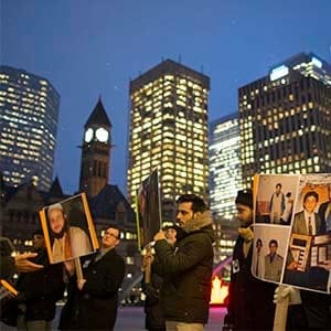 A small group of family and friends of Soleiman Faqiri, hold a vigil at Nathan Phillips Square, for the mentally ill man who died during an altercation with guards in jail in Lindsay about 8 weeks ago. (Rick Madonik/Toronto Star/Getty Images)
