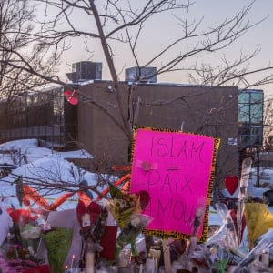 Throughout the second day after the late-night shooting at the Mosque in Quebec city, people continued to add flowers and notes and other objects as memorials for the victims on snowbanks around the perimiter of the mosque. (Photograph by Roger LeMoyne)