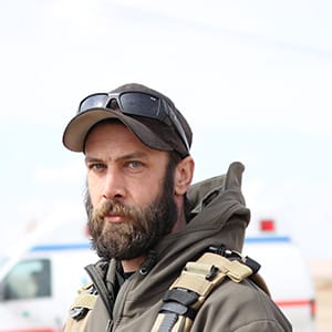 Alex Moreau, the 36- year old Vancouver native and the co-founder of MERMT outside the clinic south of Mosul that will serve as a frontline emergency medical response centre for civilians injured during phase 3 of the fight against ISIS. Moreau began as a foreign fighter in Syria but realized that emergency medical services were more important than killing ISIS fighters. (Photograph by Adnan Khan)