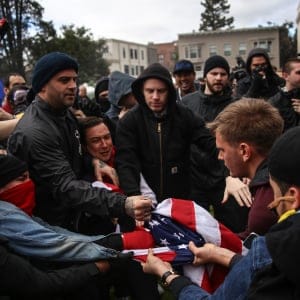Anti-Trump protestors and the supporters of U.S. President Donald Trump battle over an American flag after violence broke out during a free speech rally in Berkeley, United States on March 4, 2017. (Joel Angel Juarez/Anadolu Agency/Getty Images)