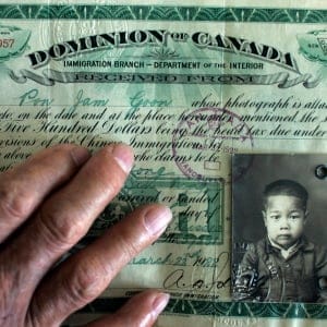 James Pon, 88, photographed at his home in Toronto. He still has the original documents showing the Chinese Head Tax paid ($500), for each his mother and him, in 1922. Pon says he almost cries every time he speaks about his father, who borrowed the $1000 to bring the two to Canada, taking 17 years to repay the debt. James Pon was sent to live, and work, on his own at the age of twelve, because his family couldn't afford to keep him. On Wednesday, June 21st, James Pon and his wife, Vera Wong Pon, will be joining other Chinese immigrants on a historic train to Ottawa to attend an official statement of apology to be read by Prime Minister Stephen Harper in the House of Commons on the 22nd. (Peter Power/Toronto Star/Getty Images)