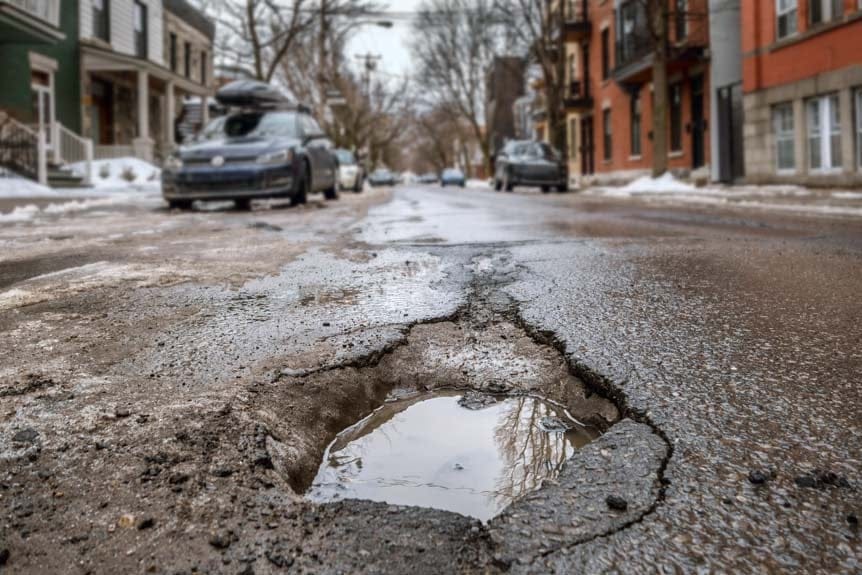 Large deep pothole in Montreal street, Canada.(Shutterstock)