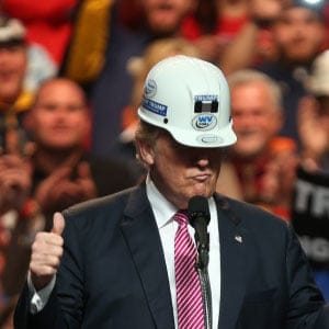 Republican Presidential candidate Donald Trump models a hard hat in support of the miners during his rally at the Charleston Civic Center on May 5, 2016 in Charleston, West Virginia. Trump became the Republican presumptive nominee following his landslide win in indiana on Tuesday. (Mark Lyons/Getty Images)