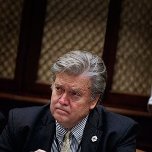 White House chief strategist Steve Bannon listens as President Donald Trump speaks during a meeting with county sheriffs in the Roosevelt Room of the White House in Washington. Saturday, Feb. 4, 2017. (Evan Vucci/AP/CP)