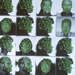 Digitized facial recognition using grid with specific female points. (Stegerphoto/Getty Images)