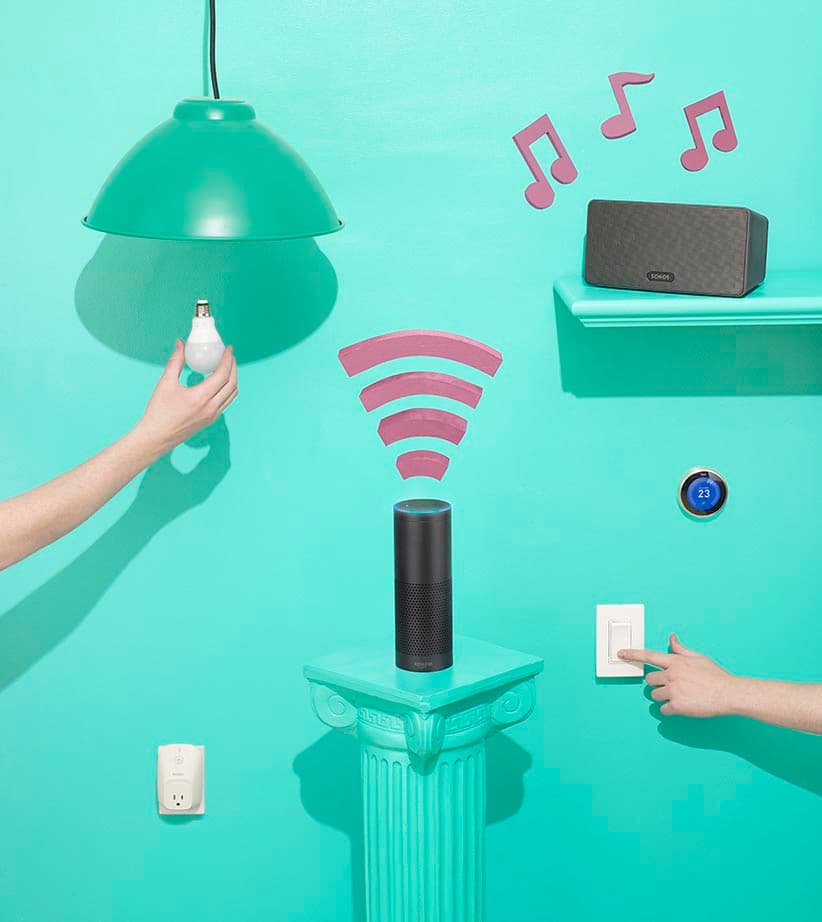 Hands with various smart objects and an Amazon Echo