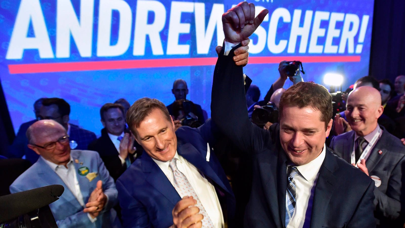 Andrew Scheer, right, is congratulated by Maxime Bernier after being elected the new leader of the federal Conservative party at the federal Conservative leadership convention in Toronto on Saturday, May 27, 2017. THE CANADIAN PRESS/Frank Gunn