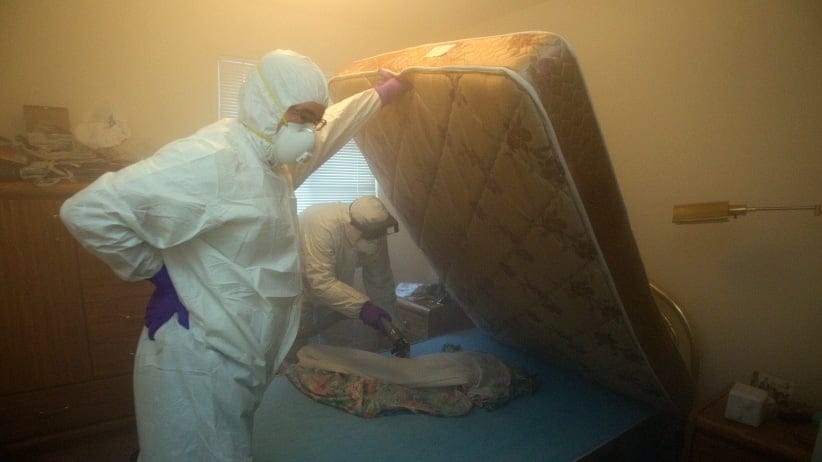 Christian Cadieux (R), owner of Bed Bugs Bite , and employee Jeff Lake fumigates a matress as part of their process to get rid of bedbugs. (Andrew Francis Wallace/Toronto Star/Getty Images)