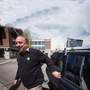 Green Party Leader Andrew Weaver gets out of a vehicle to stop to talk to reporters outside a campaign stop by NDP Leader John Horgan in Nanaimo, B.C., on Friday May 5, 2017. A provincial election will be held on Tuesday. (Darryl Dyck/CP)