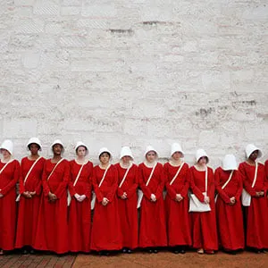 Women dressed as handmaids promoting the Hulu original series "The Handmaid's Tale" stand along a public street during the South by Southwest (SXSW) Music Film Interactive Festival 2017 in Austin, Texas, U.S., March 11, 2017. (Brian Snyder/Reuters)