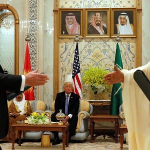 U.S. President Donald Trump (C) looks on as U.S. Secretary of State Rex Tillerson (L) and Saudi Arabia's Crown Prince Muhammad bin Nayef (R) exchange a memorandum of understanding, a commitment by the Gulf states not to finance militant organizations, at the Gulf Cooperation Council leaders summit in Riyadh, Saudi Arabia May 21, 2017. (Jonathan Ernst/Reuters)