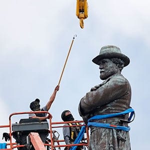 FILE- In this Friday, May 19, 2017, file photo, workers prepare to take down the statue of former Confederate general Robert E. Lee, which stands over 100 feet tall, in Lee Circle in New Orleans. Mississippi Rep. Karl Oliver of Winona apologized on Monday, May 22, for saying Louisiana leaders should be lynched for removing Confederate monuments, only after his comment sparked broad condemnation in both states. The post was made after three Confederate monuments and a monument to white supremacy were removed in New Orleans. (Gerald Herbert/AP/CP)