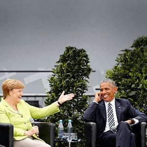 German Chancellor Angela Merkel and former U.S. President Barack Obama attend a discussion at the German Protestant Kirchentag in front of the Brandenburg Gate in Berlin, Germany, May 25, 2017. (Axel Schmidt/Reuters)