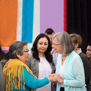 Chief Commissioner Marion Buller (right)greets Frances Neumann after she told a story about her murdered sister-in-law Mary Johns at the National Inquiry into Missing and Murdered Indigenous Women and Girls taking place in Whitehorse, Yukon, Tuesday, May 30, 2017. (Jonathan Hayward/CP)