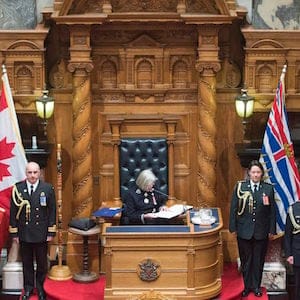 British Columbia Premier Christy Clark, left, and NDP leader John Horgan, right, look on as B.C. Lieutenant Governor Judith Guichon gives the Speech from Throne in Victoria, Thursday, June 22, 2017. THE CANADIAN PRESS/Jonathan Hayward