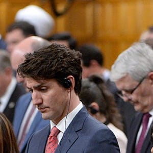 Prime Minister Justin Trudeau (centre) and Liberal MPs pause for a moment of silence for the victims of the London terror attacks during question period in the House of Commons on Parliament Hill in Ottawa on Monday, June 5, 2017. (Adrian Wyld/CP)