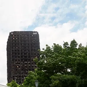 The charred remains of clading are pictured on the outer walls of the burnt out shell of the Grenfell Tower block in north Kensington, west London on June 22, 2017.
Combustible cladding has been found in "a number" of publicly-owned tower blocks in Britain following emergency checks ordered after the June 14 devastating fire at Grenfell Tower, British Prime Minister Theresa May said Thursday. "A number of these tests have come back as combustible," May said in a statement to parliament after ordering checks on all similar blocks. (NIKLAS HALLE'N/AFP/Getty Images)