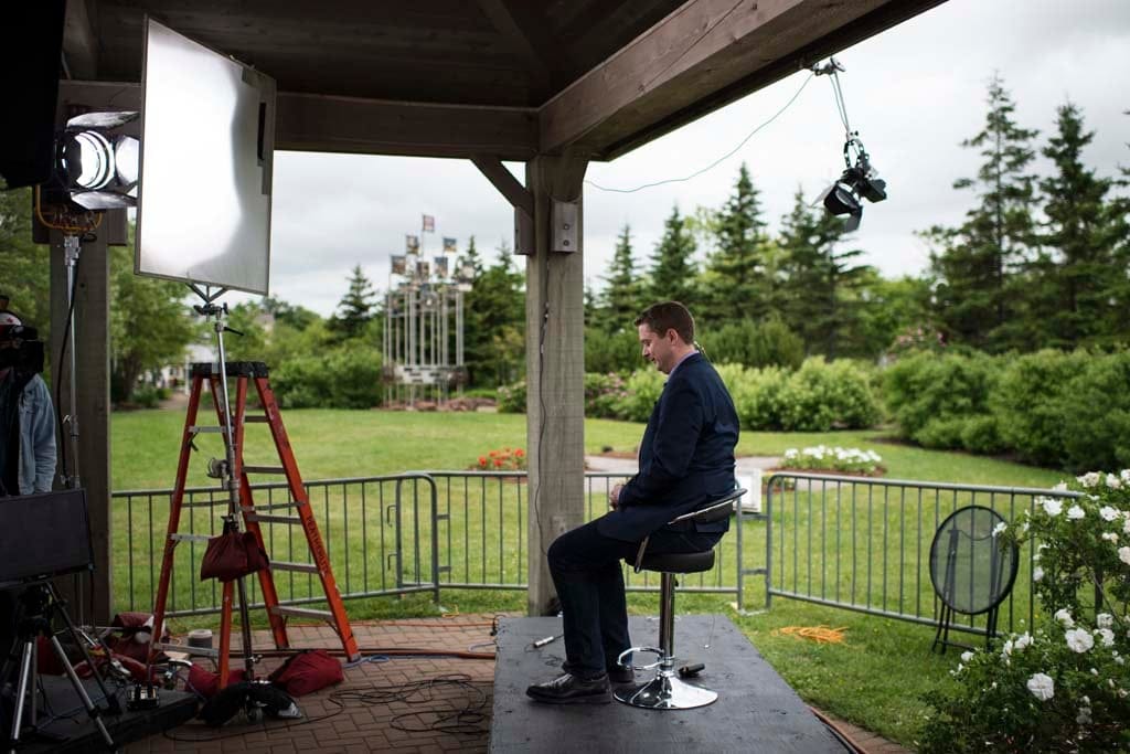 Conservative Party Leader Andrew Scheer prepares for an on-air interview with the CBC's Peter Mansbridge in Charlottetown, P.E.I. on Canada Day, Saturday, July 1, 2017. (Photograph by Darren Calabrese)