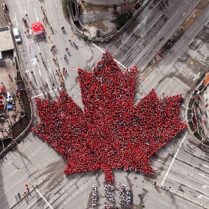 Winnipeggers got together today to celebrate Canada's 150th birthday by forming a "Living Leaf" at the historic downtown intersection of Portage and Main, Saturday, July 1, 2017. Organizers said that 4000 people showed up to show off their love for Canada. THE CANADIAN PRESS/John Woods