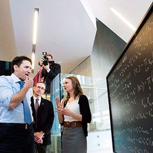 Prime Minister Justin Trudeau looks at a chalk board before making an announcement at the Perimeter Institute for Theoretical Physics in Waterloo, Ont., on Friday, April 15, 2016. (Nathan Denette/CP)