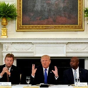 U.S. President Donald Trump speaks during a lunch meeting with Senate Republicans to discuss healthcare at the White House in Washington, U.S., July 19, 2017. From left are U.S. Senators Shelley Moore Capito (R-WV), Dean Heller (R-NV), Tim Scott (R-SC) and Lisa Murkowski (R-AK). (Kevin Lamarque/Reuters)