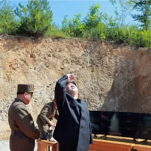 This picture taken on July 4, 2017 and released by North Korea's official Korean Central News Agency (KCNA) on July 5, 2017 shows North Korean leader Kim Jong-Un (R) inspecting the successful test-fire of the intercontinental ballistic missile Hwasong-14 at an undisclosed location. South Korea and the United States fired off missiles on July 5 simulating a precision strike against North Korea's leadership, in response to a landmark ICBM test described by Kim Jong-Un as a gift to "American bastards". (STR/AFP/Getty Images)