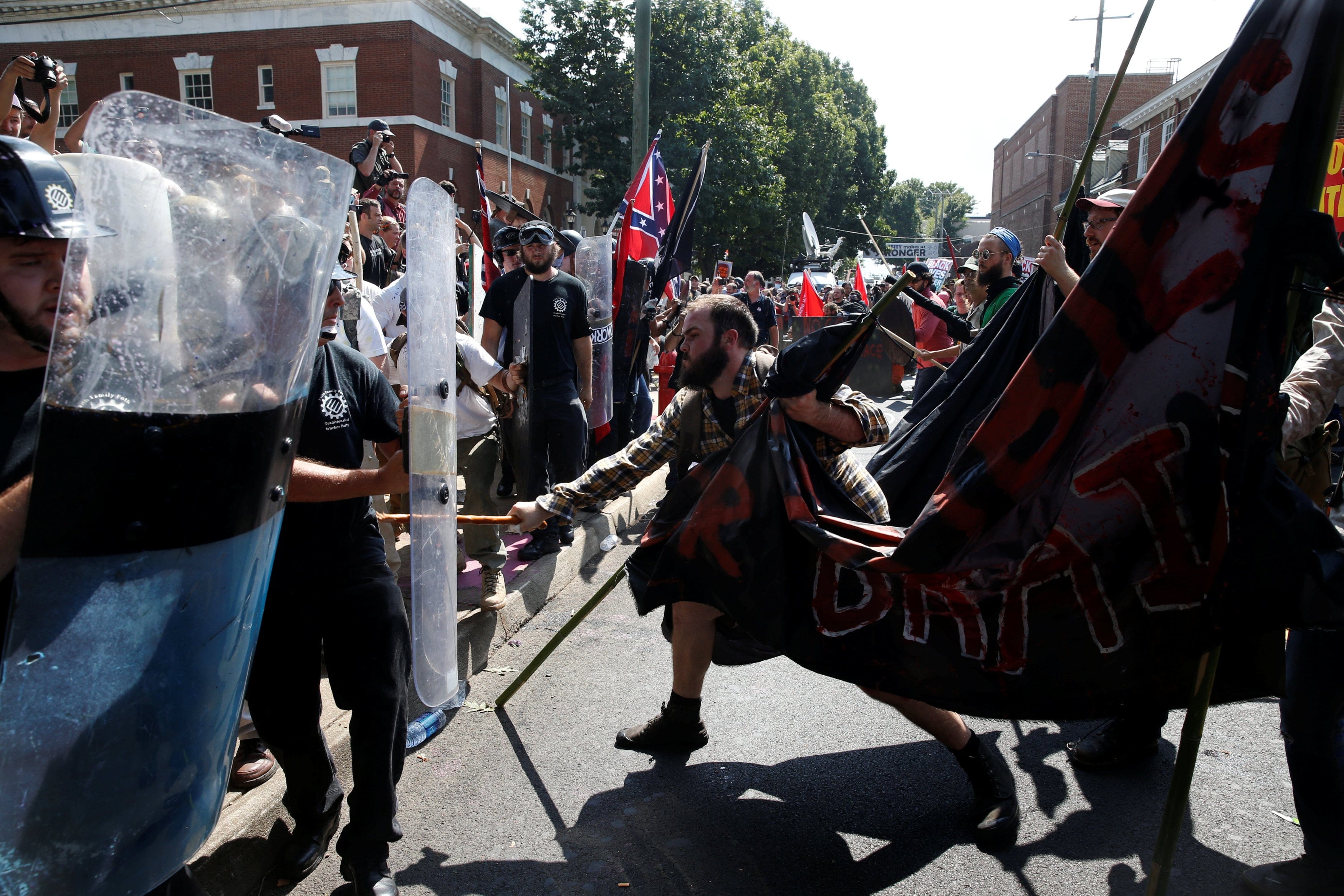 Members of white nationalists clash against a group of counter-protesters in Charlottesville, Virginia, U.S., August 12, 2017. REUTERS/Joshua Roberts