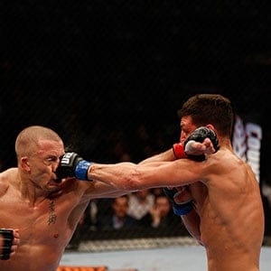 Nick Diaz punches Georges St-Pierre in their welterweight championship bout during the UFC 158 event at Bell Centre on March 16, 2013 in Montreal, Quebec, Canada. (Josh Hedges/Zuffa LLC/Zuffa LLC/Getty Images)
