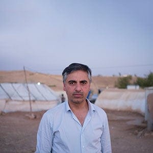 Payam Akhavan, law professor at McGill University at Yazidi refugee camp Khanke outside of Duhok, Iraq, July 26, 2016. (Photograph by Peter Bregg, C.M.)