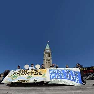 Indigenous leadership, community members and allies of Treaty 8 territory of northeast British Columbia converge on Parliament Hill in Ottawa to protest Site C hydroelectric dam projecton Tuesday, Sept. 13, 2016. THE CANADIAN PRESS/Sean Kilpatrick