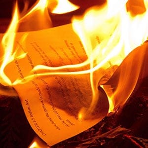 Members of the Huu-ay-aht First Nation burn a copy of the Indian Act during a ceremony where they held the first sitting of their legislature and signed a constitution after implementing the historic Maa-nulth Final Agreement in Anacla, B.C., in the early morning hours of Friday April 1, 2011. It is the first modern-day treaty on Vancouver Island and restores self government to the small First Nations community. (Darryl Dyck/CP)