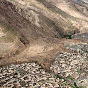 An aerial view shows the site of Friday's landslide that buried Abi Barik village in Badakhshan province, northeastern Afghanistan, Monday, May 5, 2014. Hundreds of people were killed in a horrific landslide and authorities are trying to help the 700 families displaced by the torrent of mud that swept through their village. The families left their homes due to the threat of more landslides, Minister for Rural Rehabilitation Wais Ahmad Barmak said. (Rahmat Gul/AP/CP)