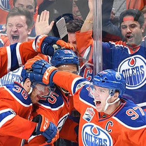 Connor McDavid #97, Drake Caggiula #36, Darnell Nurse #25 and Adam Larsson #6 of the Edmonton Oilers celebrate after a goal in Game Two of the Western Conference First Round during the 2017 NHL Stanley Cup Playoffs against the San Jose Sharks on April 14, 2017 at Rogers Place in Edmonton, Alberta, Canada. (Andy Devlin/NHLI/Getty Images)