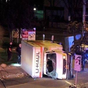 A rental truck lies on its side in Edmonton, Canada, on October 1, 2017, after a high speed chase.
Canadian police arrested a man early Sunday suspected of stabbing an officer and injuring four pedestrians in a series of violent incidents being investigated as an "act of terrorism." The crime spree began late September 30 outside a football stadium and ended hours later with a high speed chase in which the driver of the rented truck plowed into pedestrians, police said.
/ AFP PHOTO / Michael MUKAI (Photo credit should read MICHAEL MUKAI/AFP/Getty Images)