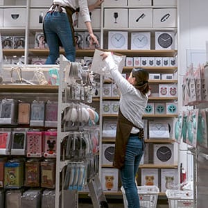 Sales staff in a Miniso shop. Miniso is a Japanese lifestyle and fast fashion brand that sells merchandise such as homeware, bags and electronics at low prices. Despite claiming to be a Japanese brand, Miniso had only four stores in Tokyo compared with more than a thousand in China, therefore is widely questioned by the users for the brands origin and copyright. (Zhang Peng/LightRocket/Getty Images)