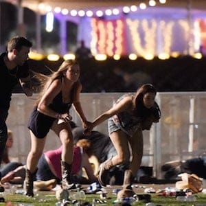 LAS VEGAS, NV - OCTOBER 01: People run from the Route 91 Harvest country music festival after apparent gun fire was hear on October 1, 2017 in Las Vegas, Nevada. A gunman has opened fire on a music festival in Las Vegas, leaving at least 20 people dead and more than 100 injured. Police have confirmed that one suspect has been shot. The investigation is ongoing. (Photo by David Becker/Getty Images)
