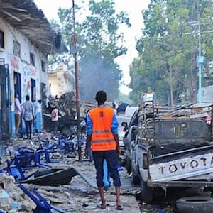 People stand among damages at the scene of a blast after two car bombs exploded in Mogadishu on October 28, 2017.
A car packed with explosives blew up outside a hotel in Mogadishu on October 28 as a minibus also exploded at a nearby junction, with the emergency services reporting "many dead bodies". Witnesses reported hearing gunfire and said the entire area around the Nasa Hablod hotel was sealed off by security forces to keep people away. The blasts occurred just two weeks after a huge truck bombing in the Somali capital which killed at least 358 people, making it the deadliest attack in the country's history.
/ AFP PHOTO / Mohamed ABDIWAHAB (Photo credit should read MOHAMED ABDIWAHAB/AFP/Getty Images)