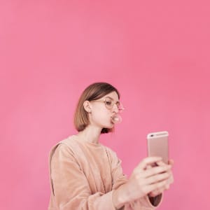 millennial or generation z woman taking selfie
